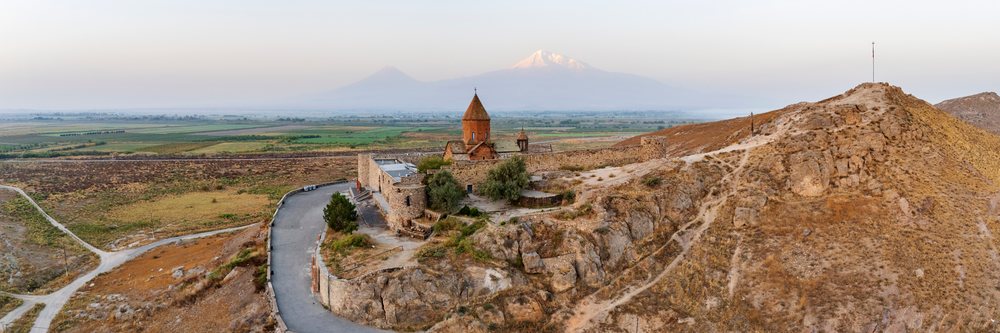 Khor Virap Monastery sits atop a rocky hill with Mount Ararat visible in the background, Lusarat, Ararat Province, Armenia.