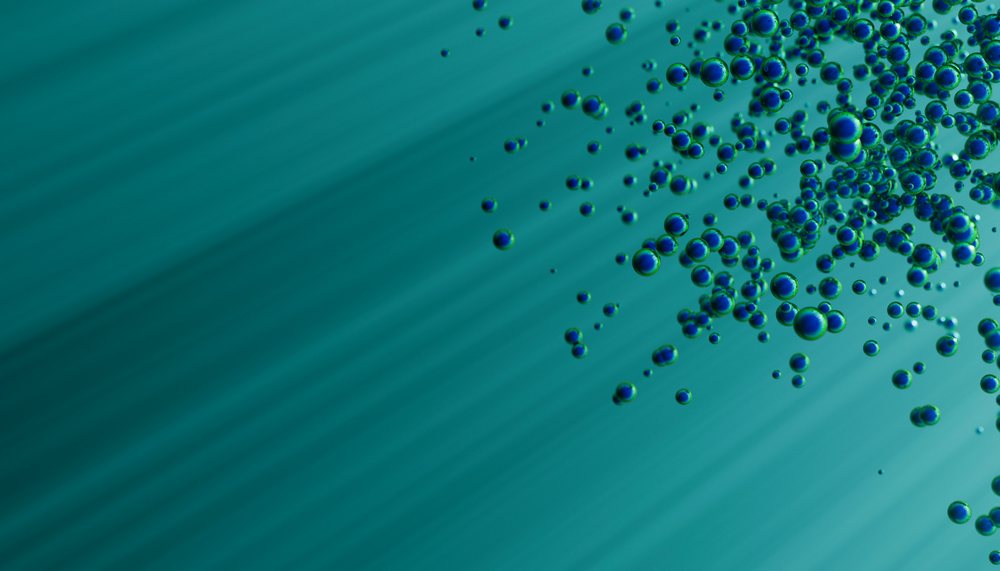 Bubbles cluster and rise underwater with a greenish-blue gradient background.