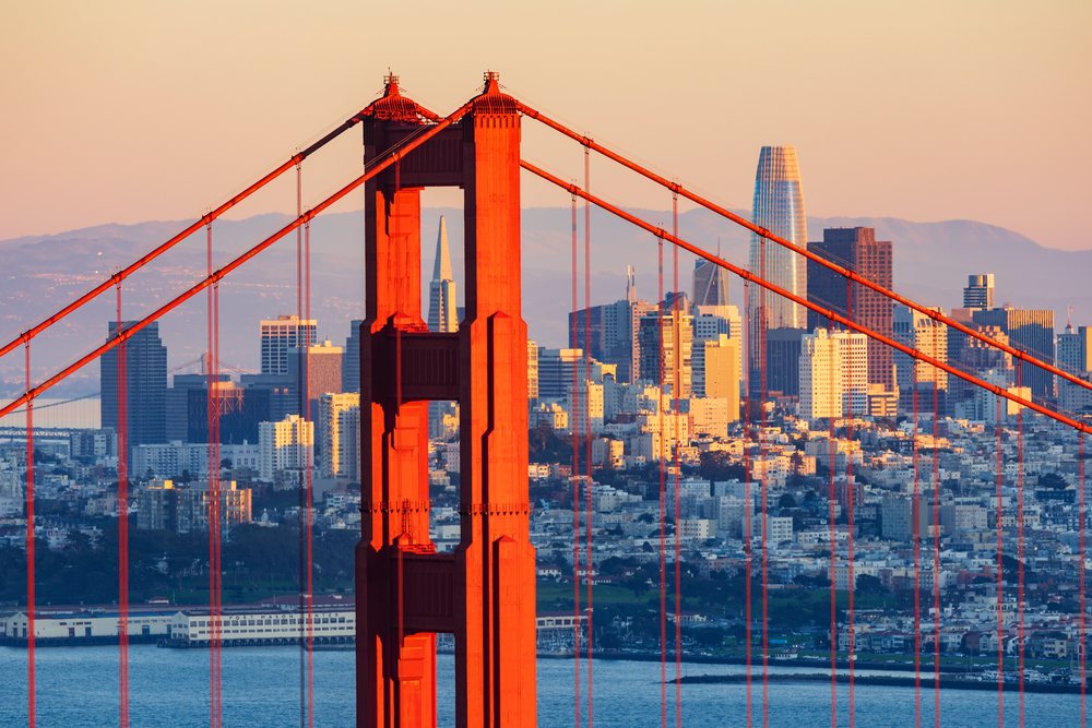 Golden Gate Bridge and Downtown San Francisco from Marin Headlands at Sunset.