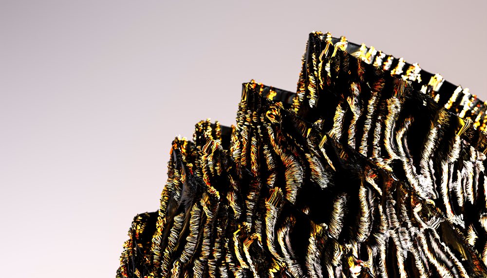 Close-up view of a black tourmaline crystal cluster showcasing striated textures and shiny surfaces.