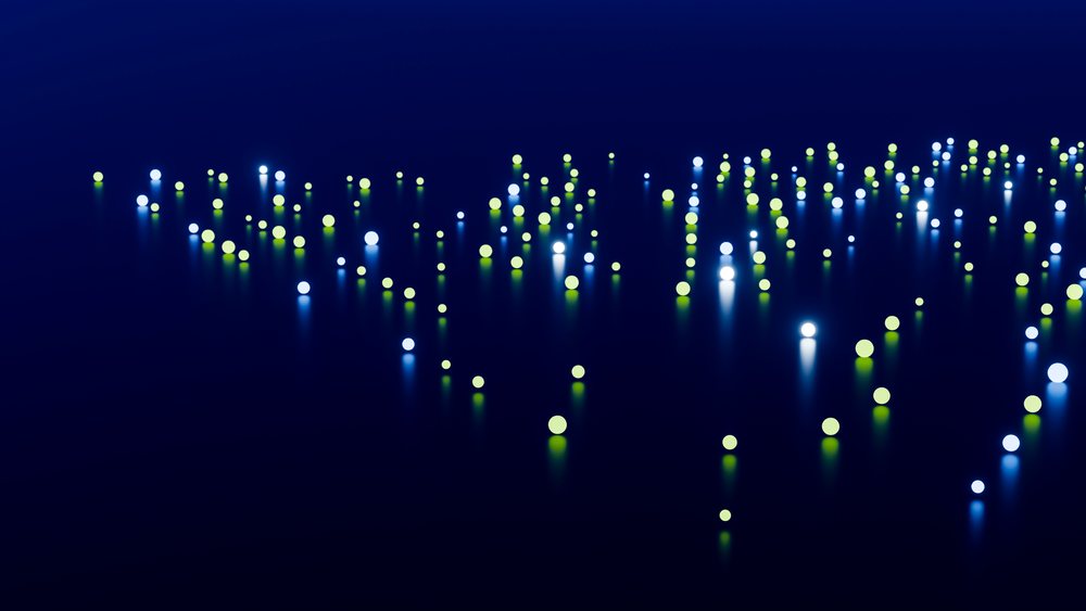 Blue and green glowing spheres scattered on a reflective dark surface in an abstract digital art scene.
