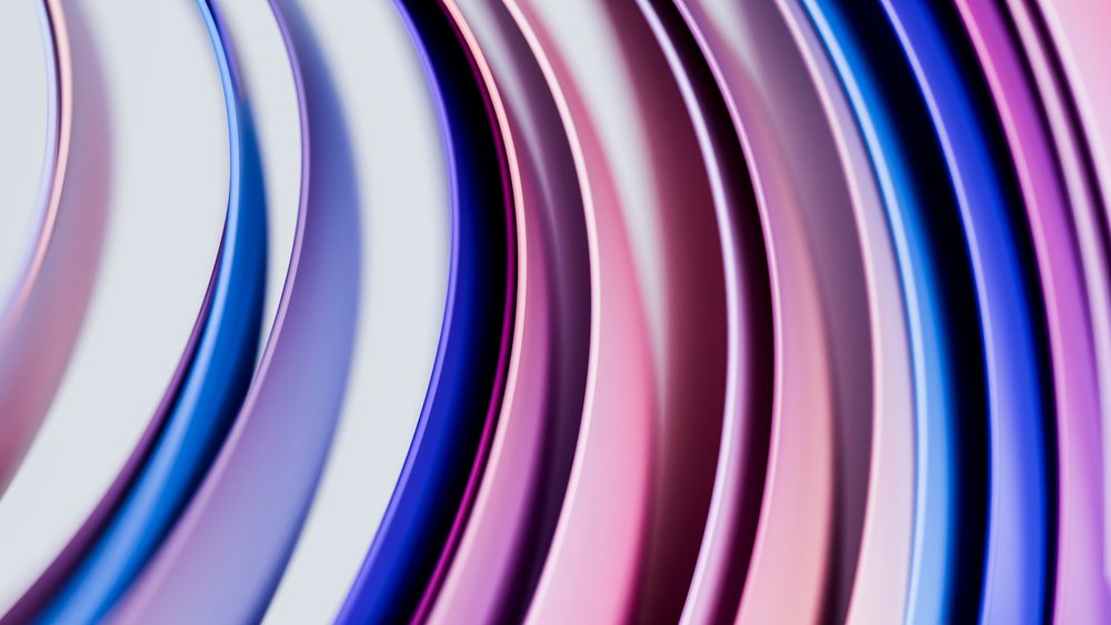 Colorful abstract curved lines in blue, pink, and purple flow smoothly creating a vibrant digital design.