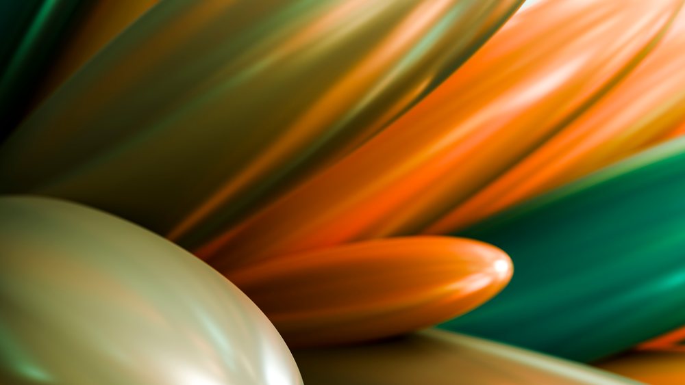 Close-up of shiny orange and green inflated foil balloons creating an abstract festive background texture.