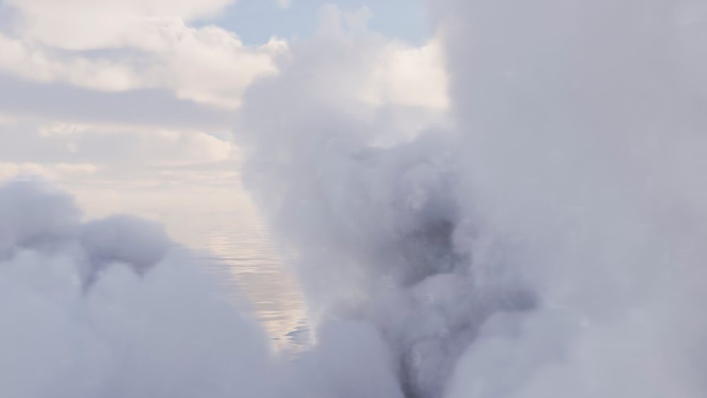 Thick white clouds with partial blue sky visible in the background on a calm day.