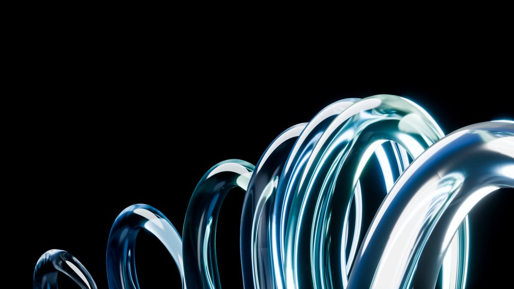 Multiple glowing transparent loops twisted and intertwined form a futuristic abstract design on a dark background with blue and white light reflections.