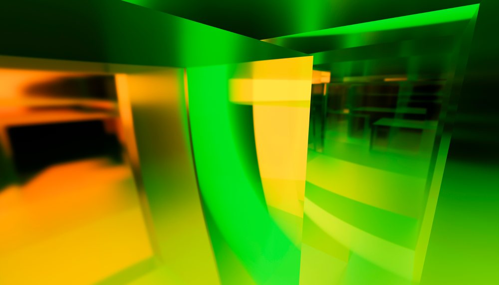 Abstract colorful glass panels featuring green, yellow, and orange hues creating a modern transparent layered design.