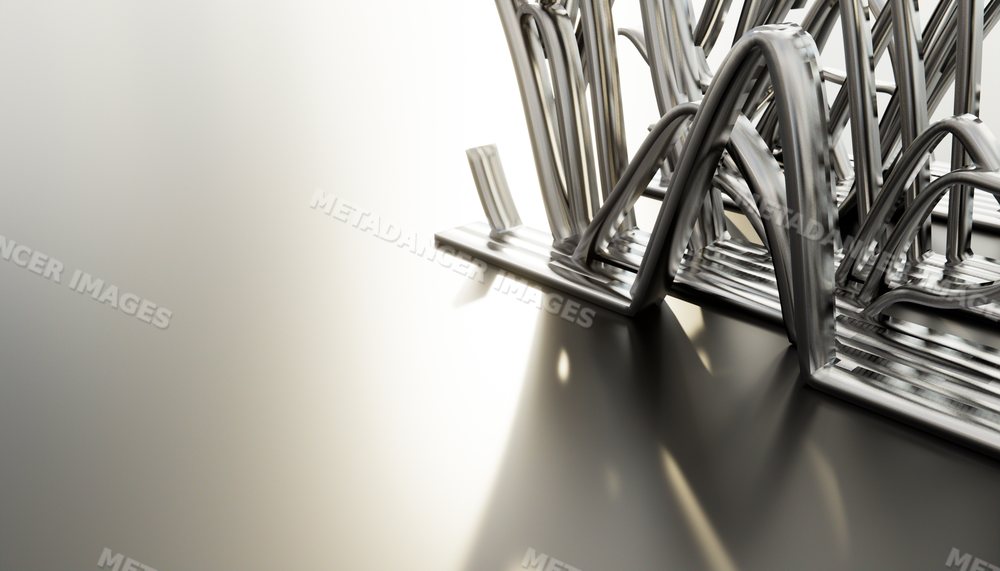 Close-up of a metal file organizer on a smooth office desk