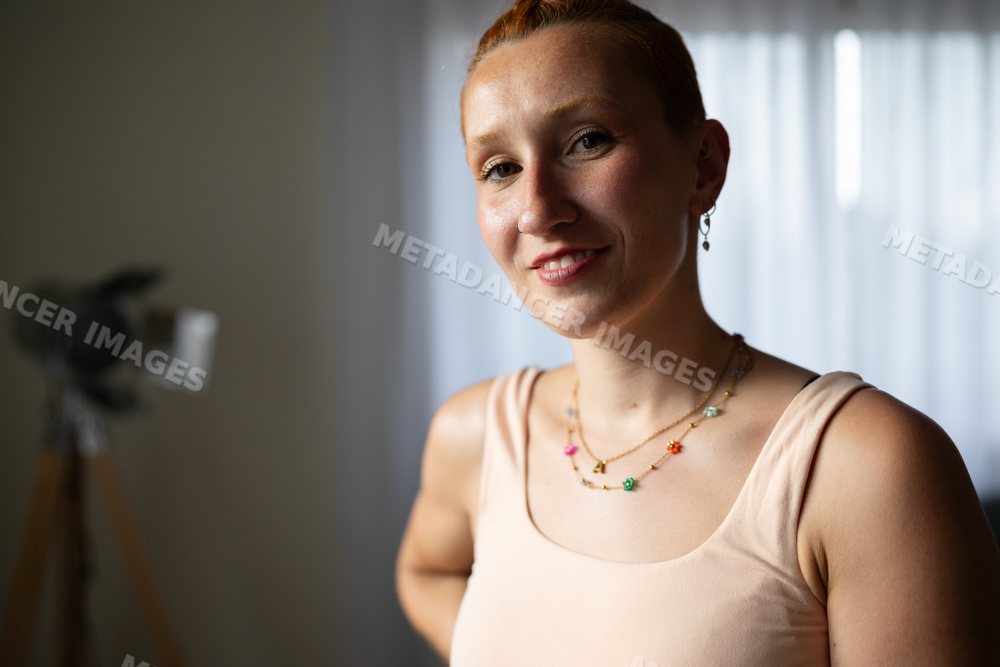 Smiling white woman with short hair indoors at home in Galicia Spain