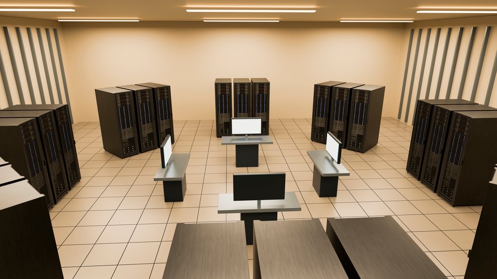 Multiple server racks and computer monitors on stands in a modern indoor data center with a tile floor.