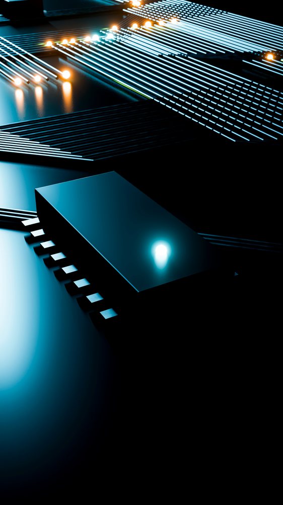 Microchip on a circuit board illuminated by glowing LED lights showing electronic connections.