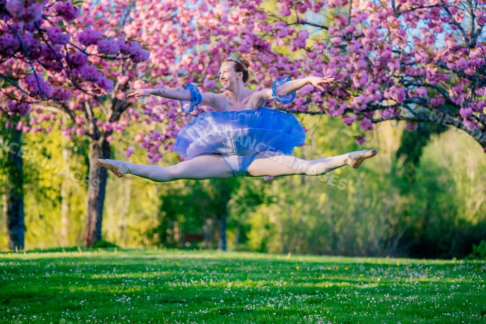 Ballerina performing a split jump