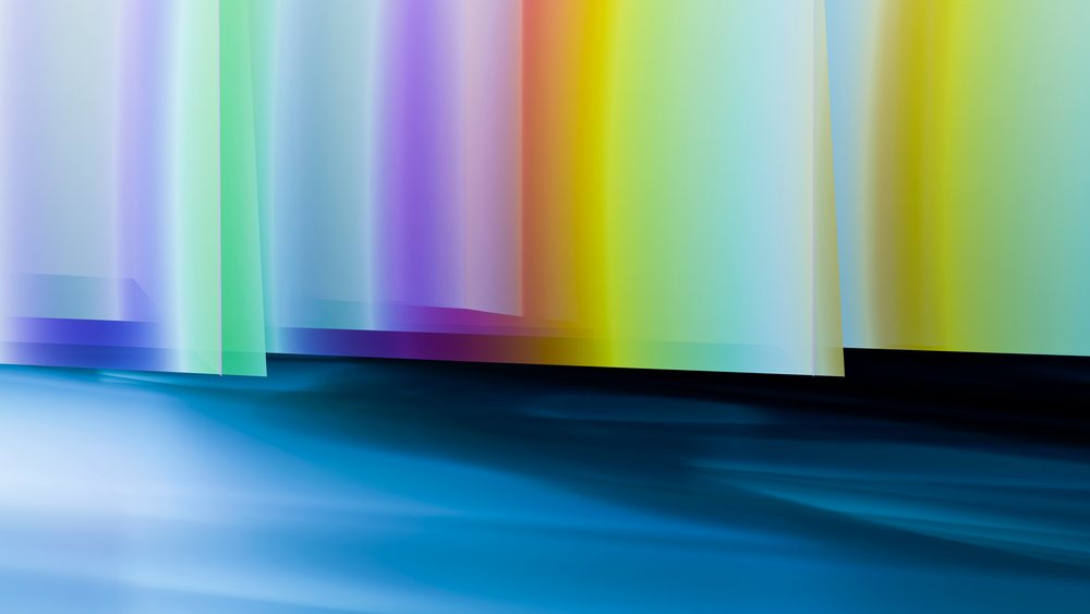 Abstract colorful gradient light shapes with blue tones and soft translucent layers.