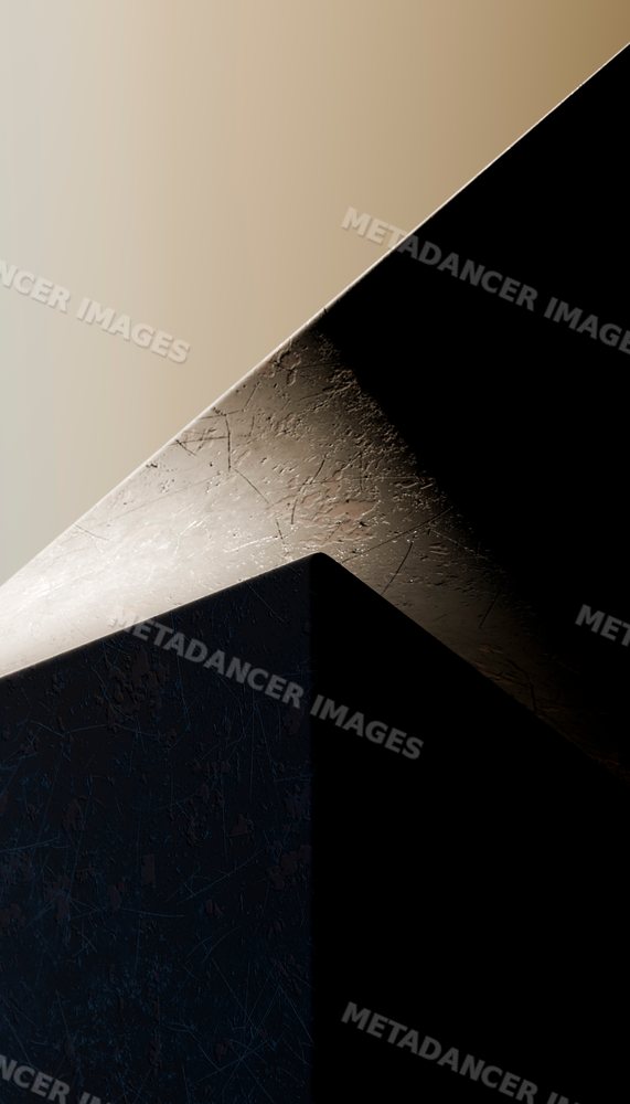 Close-up of scratched metal cube under contrasting light and shadow