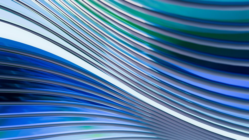 Abstract blue and green smooth curved waves flow dynamically in a digital illustration.
