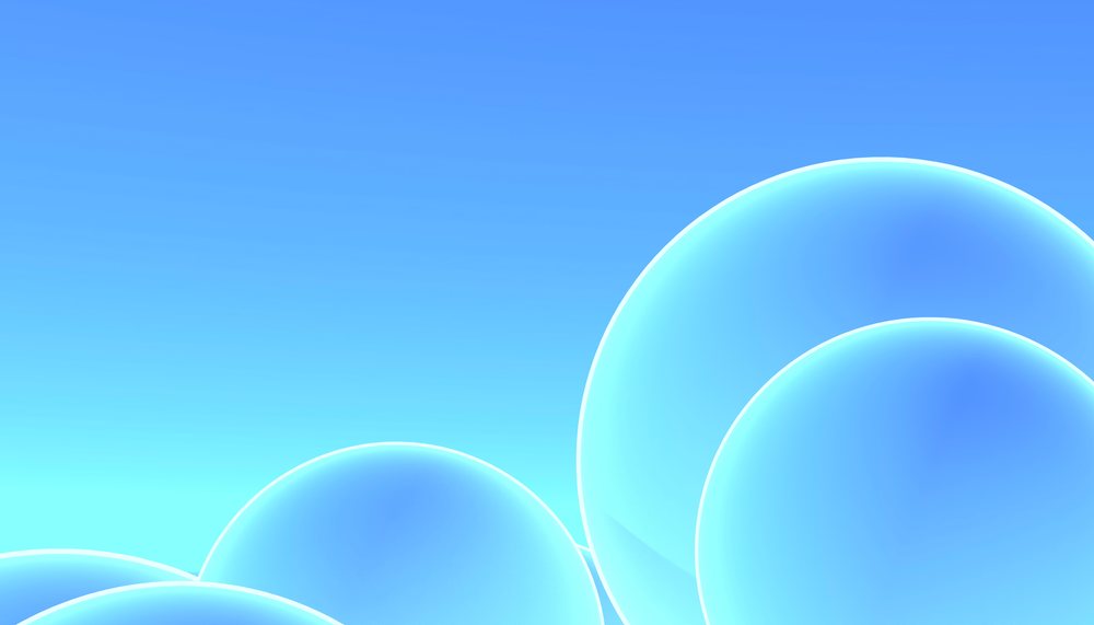 Blue transparent glowing spheres arranged against a smooth blue gradient background in a digital abstract design.