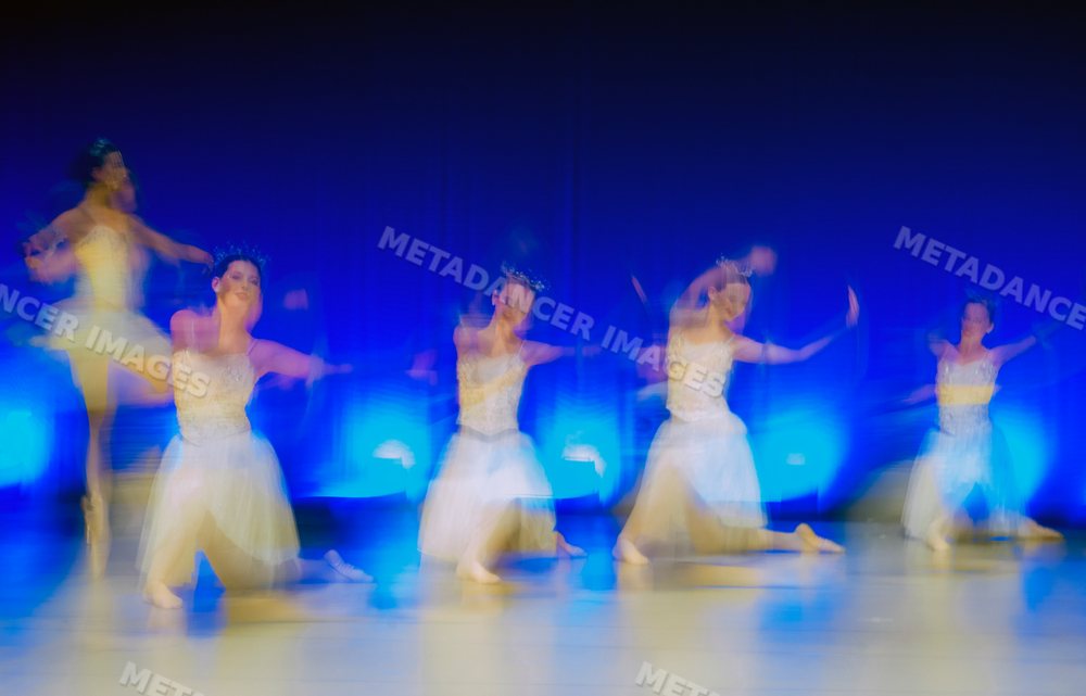 Ballet dancers perform a blurred movement routine