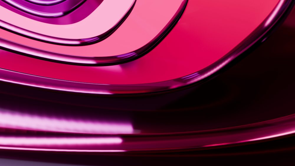 Abstract modern design features shiny curved reflective surfaces in pink and magenta with a smooth glossy texture.