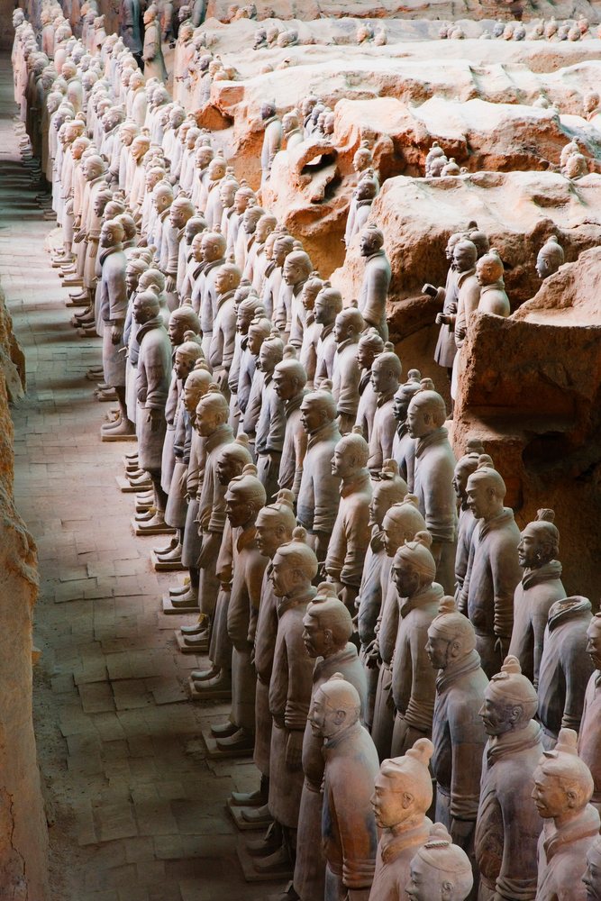 Rows of terracotta warriors statues standing inside the archaeological site, Shaanxi Province, China.