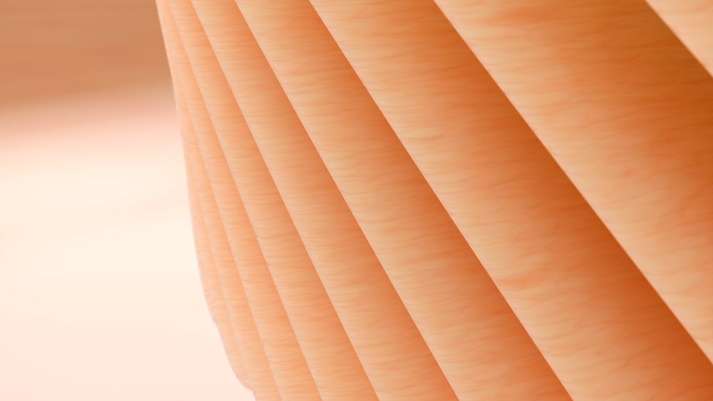 Close-up of an orange textured wood surface.