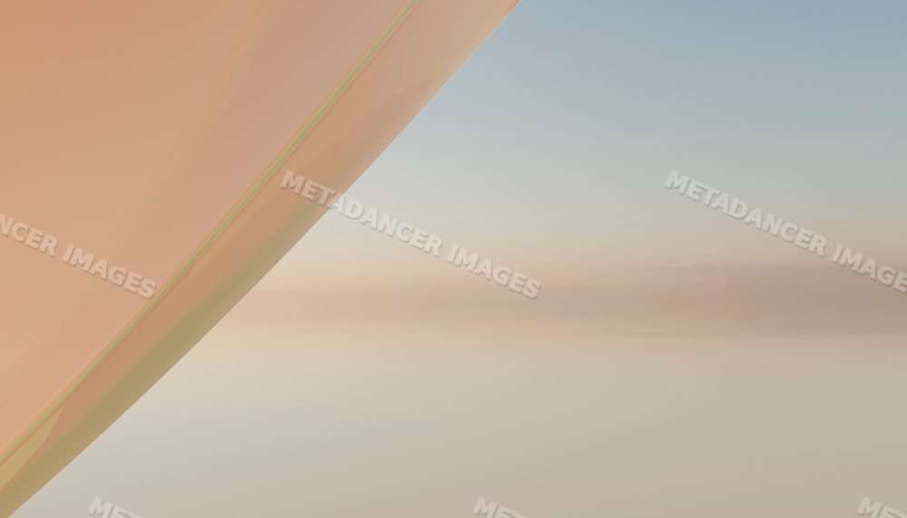 View of an airplane wing with clear sky and soft clouds during daytime