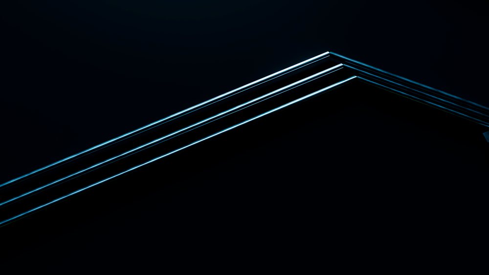 Blue neon lines illuminate a dark ceiling corner highlighting minimalist geometric architectural detail.