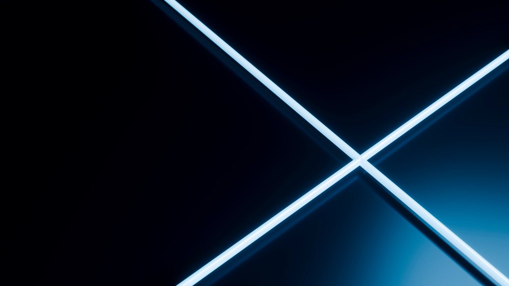 Neon blue light lines intersect in a cross pattern on a dark reflective surface with ambient blue glow.