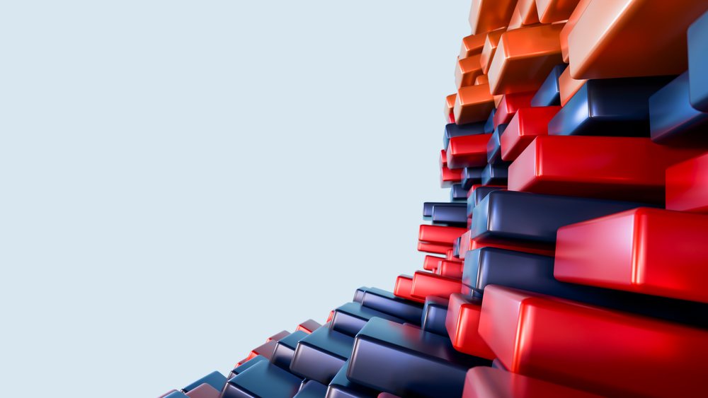 Stacked 3D red and blue rectangular blocks form an abstract geometric pattern on a light background.