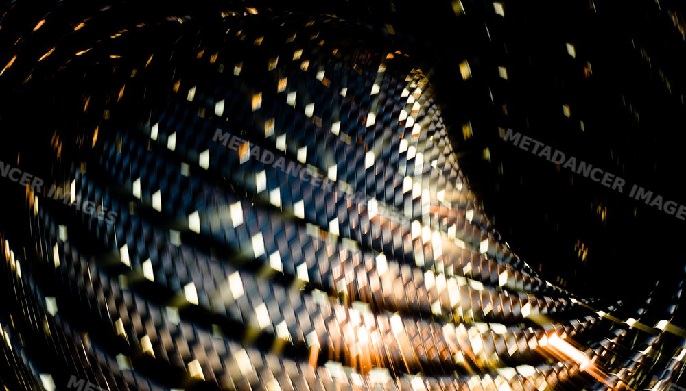 Abstract digital rendering of a twisted woven pattern with metallic