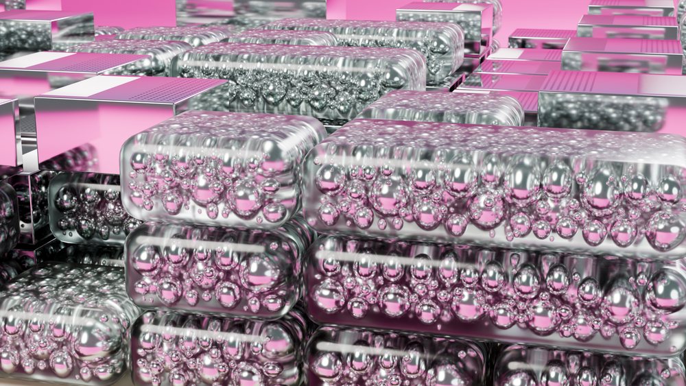 Stacked transparent blocks filled with bubbles form a reflective abstract composition on a pink background.