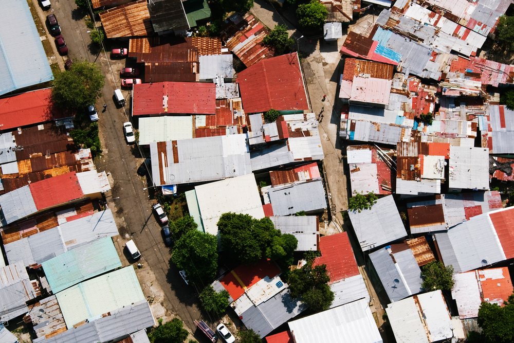 Aerial view of shanty houses with metal roofs and streets, Panama City.