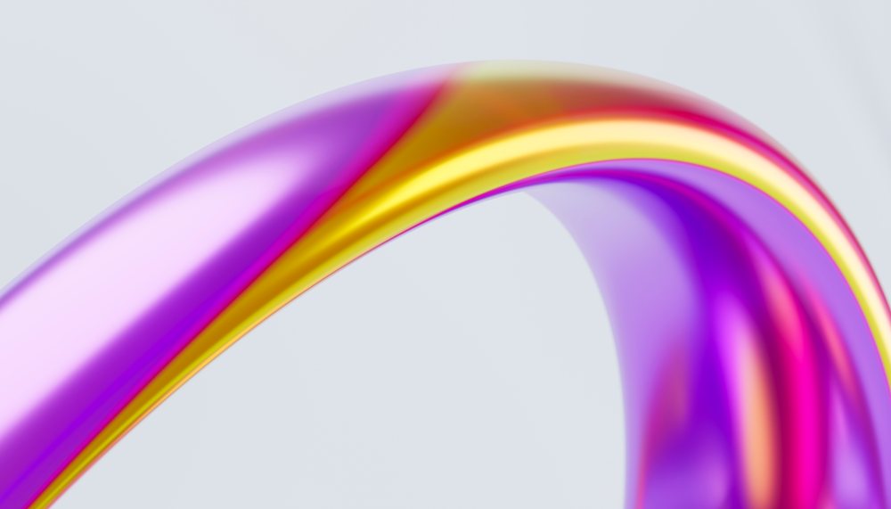 Colorful abstract loop with smooth, shiny curves in purple, pink, yellow, and orange on a light background.