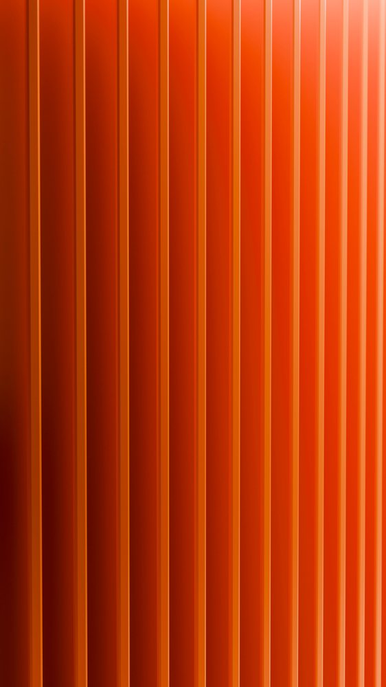 Orange wall with vertical stripes and shadow effects creating a smooth, modern abstract design.