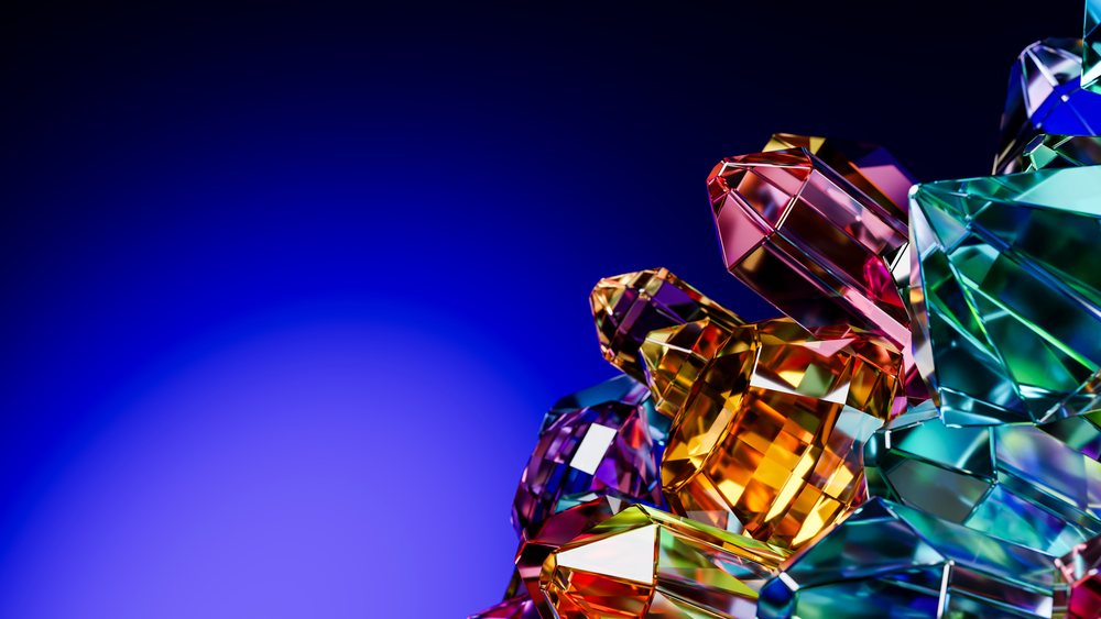 Digital 3D rendered illustration of a faceted, multicolored crystal gemstone cluster on a blue gradient background.