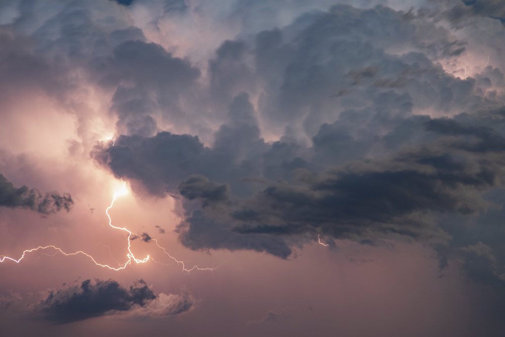 Lightning strike illuminating turbulent Supercell storm clouds over, Nara Visa, New Mexico, USA.