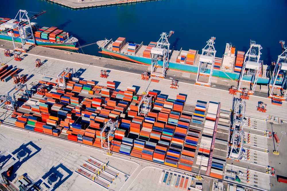 Container ship docked and being loaded with shipping containers at the Long Beach port, California, Port of Long Beach, CA, USA.