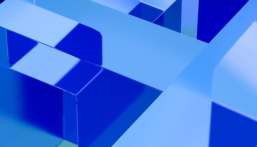 Abstract render showing shiny blue geometric shapes with overlapping smooth reflective surfaces.