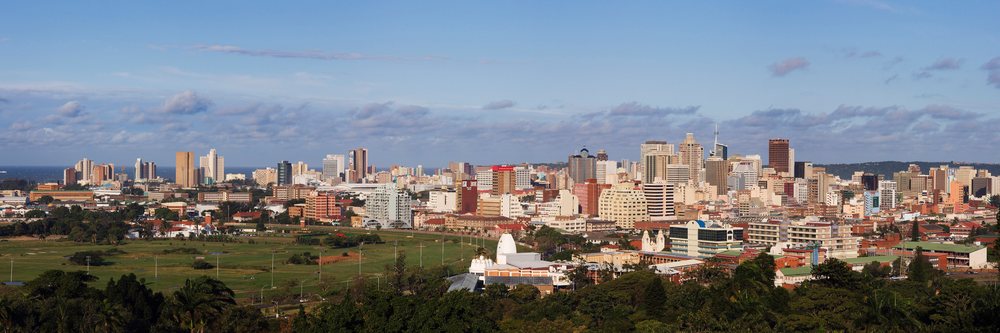 View of Durban city skyline with greenery and Indian Ocean visible from Berea, KwaZulu Natal, South Africa.