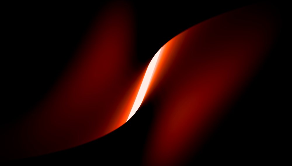 Abstract glowing red curved light shape softly illuminates against a black background.