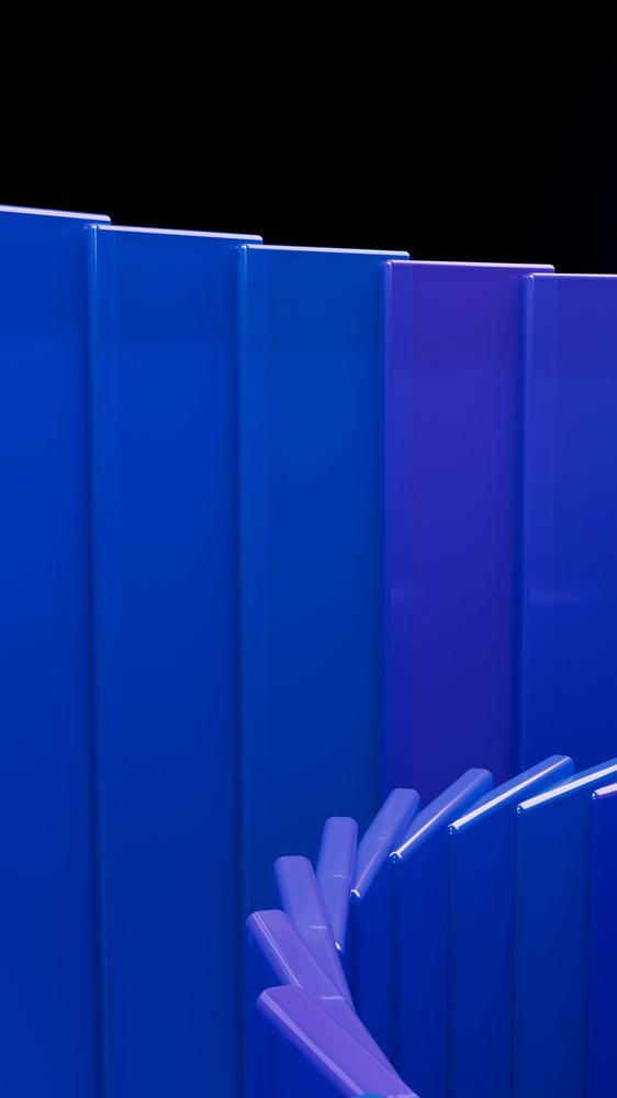 Abstract design featuring curved blue and purple glossy panels arranged vertically against a black studio background.