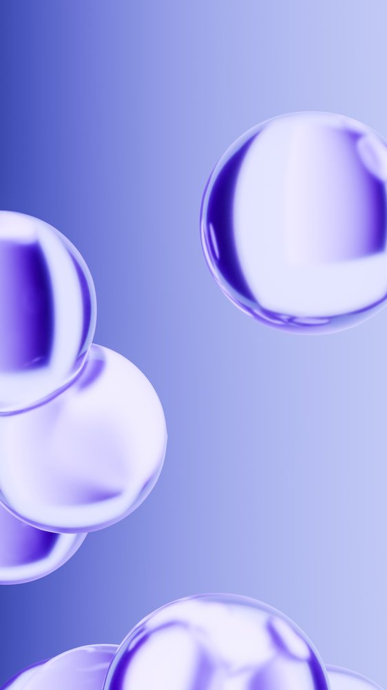 Abstract render of floating glossy and transparent purple spheres on a smooth blue gradient background.