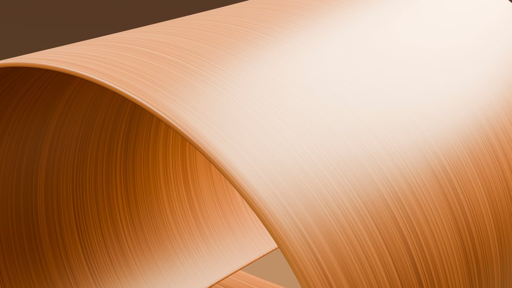 Curved smooth wooden surface showing natural brown and beige grain texture.