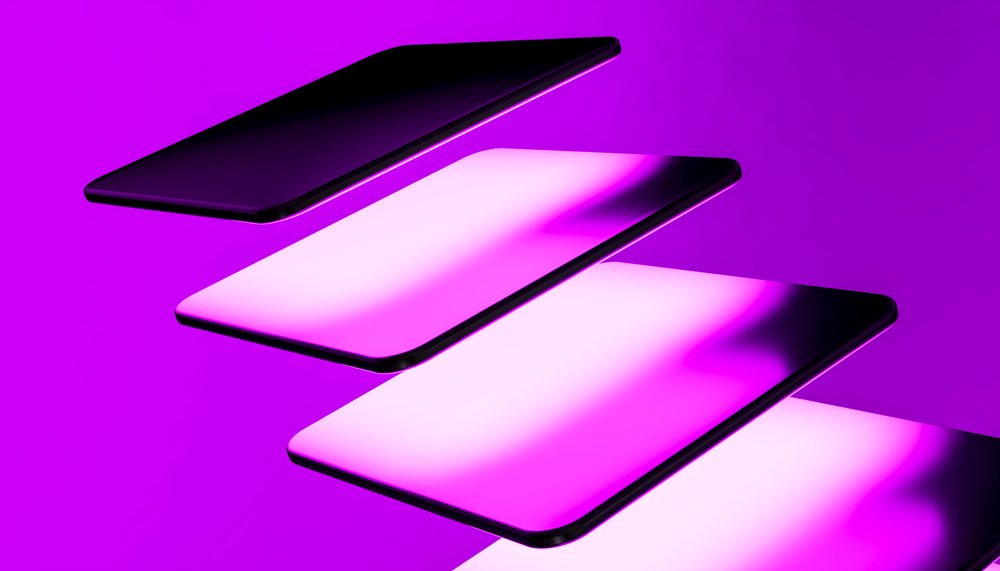 Floating smartphones with glowing purple screens in a modern digital technology concept studio.