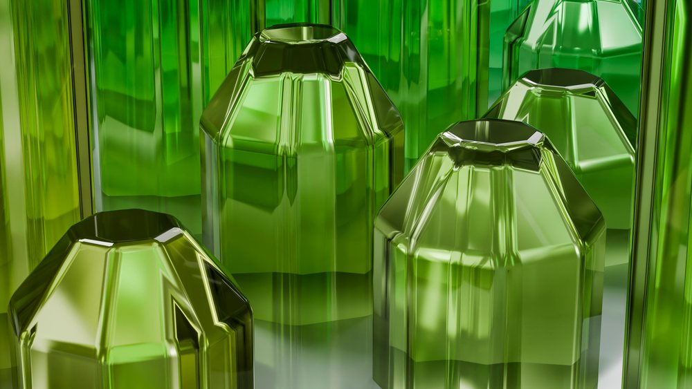 Abstract 3D illustration featuring multiple transparent green faceted geometric crystal shapes with reflective surfaces.