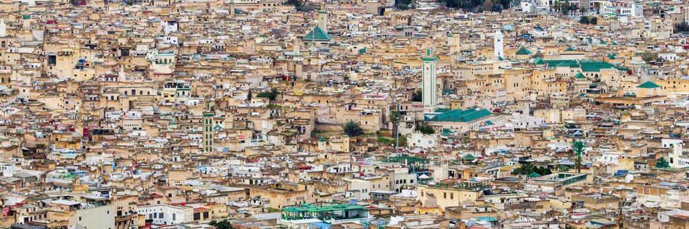 Skyline of the Medina, showing dense historic buildings and multiple minarets in a North African urban landscape, Fes, Fes-Mekners Administrative Regio, Morocco.