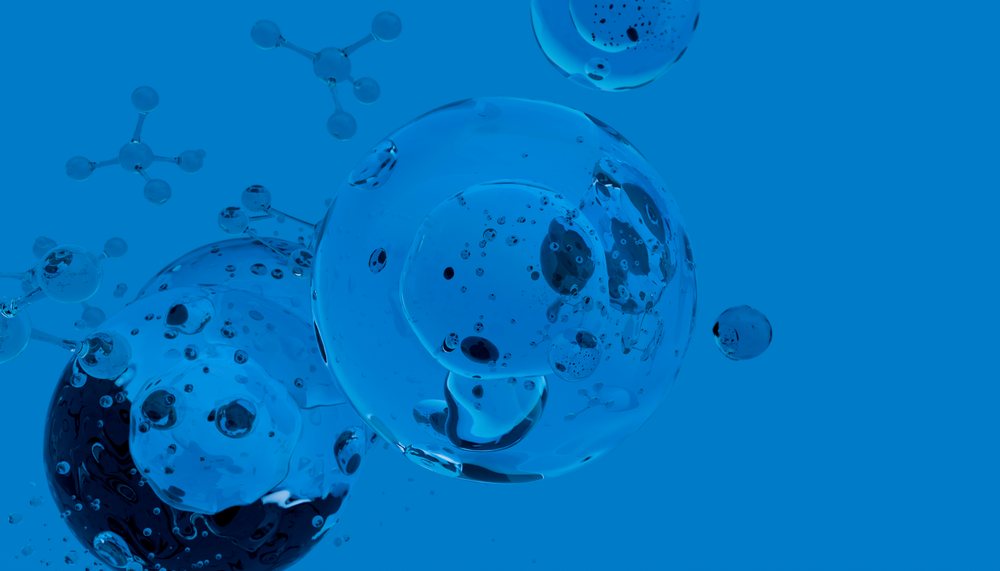 Molecular structures featuring transparent spheres connected by chemical bonds set against a blue background.