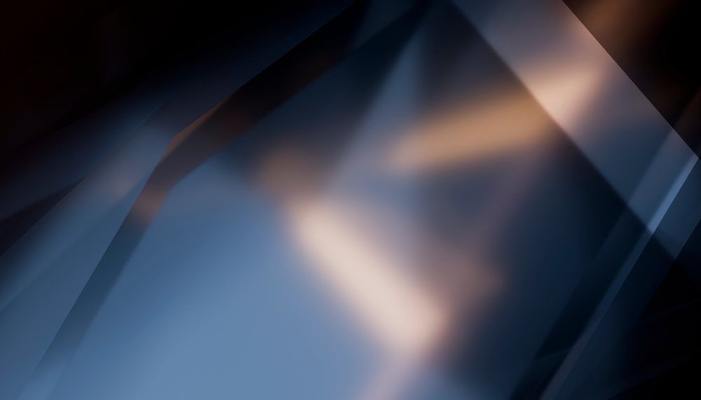Abstract geometric shapes with soft lighting and blurred lines create a modern and artistic background effect.