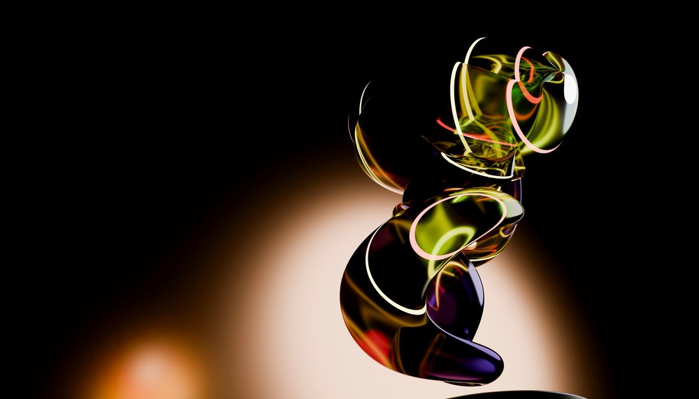 Abstract glass sculpture with colorful reflective surfaces on a dark background.