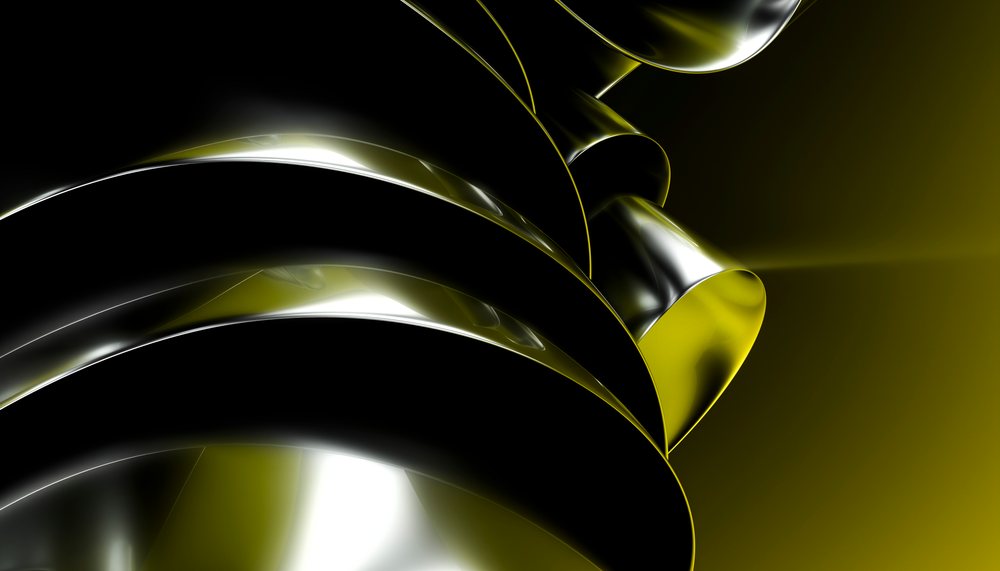 Abstract metal shapes with curved reflective surfaces in black and yellow lighting on a dark background.
