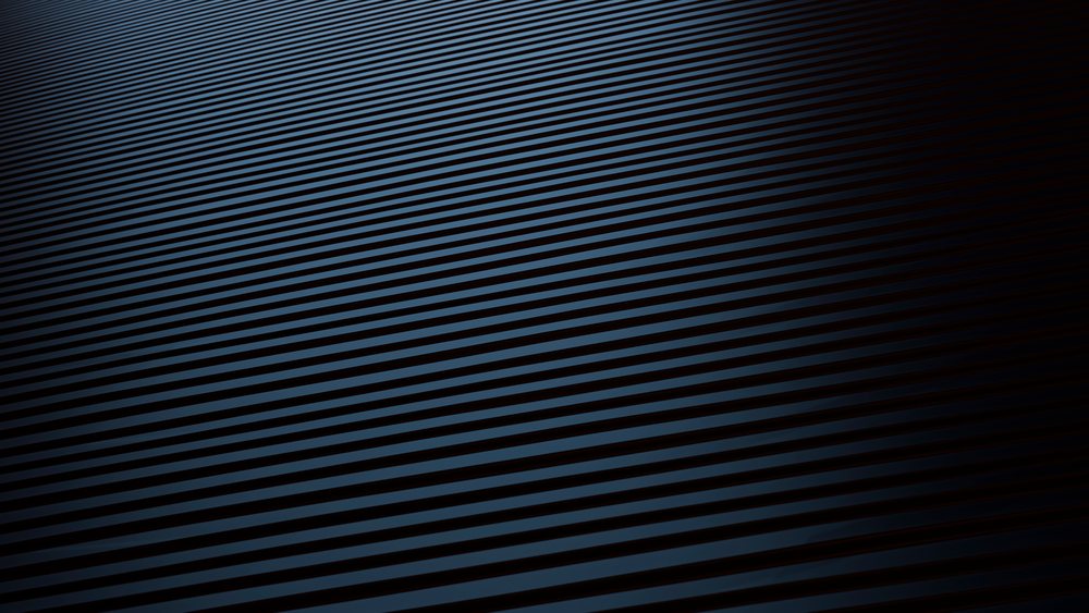 Dark diagonal striped abstract pattern showing linear repetition and shadow effects creating texture.