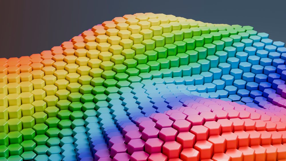 3D geometric hexagon pattern featuring a rainbow color gradient in an abstract wave form.